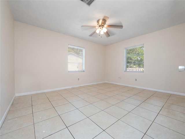 1432 Findlay St, Deltona, FL 32725 - empty room featuring healthy amount of natural light, a ceiling fan, and light tile patterned floors