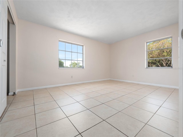 1432 Findlay St, Deltona, FL 32725 - unfurnished bedroom with light tile patterned floors and a closet