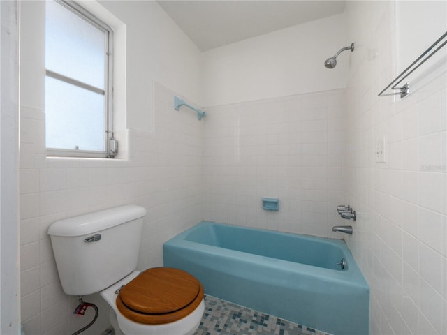 1432 Findlay St, Deltona, FL 32725 - full bathroom with tile walls and shower / bath combination