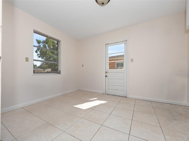 1432 Findlay St, Deltona, FL 32725 - spare room with plenty of natural light and light tile patterned floors