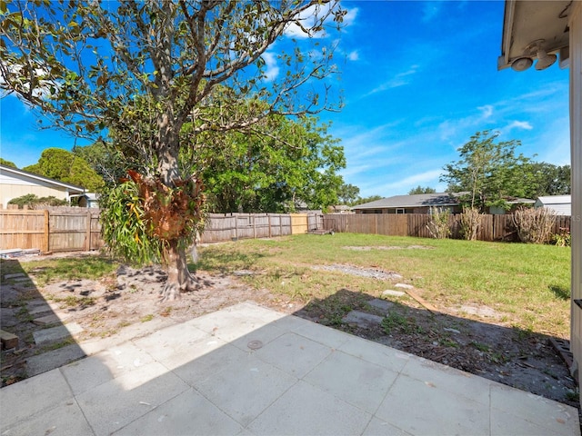 1432 Findlay St, Deltona, FL 32725 - fenced backyard with a patio area
