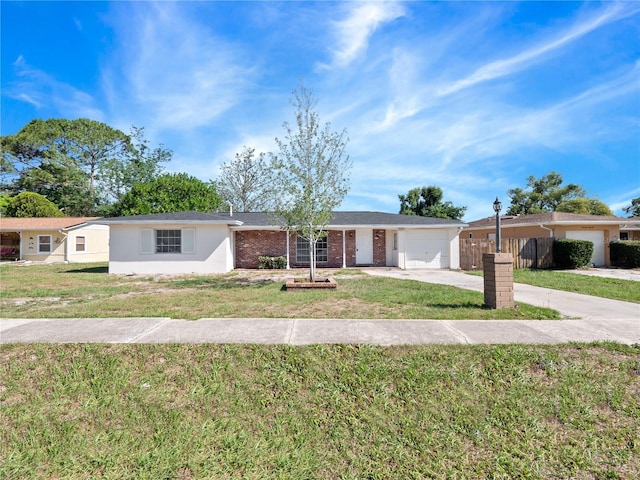 1432 Findlay St, Deltona, FL 32725 - ranch-style house featuring an attached garage, concrete driveway, and brick siding