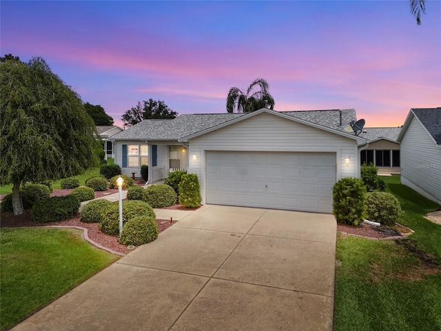 8076 SE 174th Belhaven Loop, The Villages, FL 32162 - ranch-style home with concrete driveway, an attached garage, a lawn, and roof with shingles