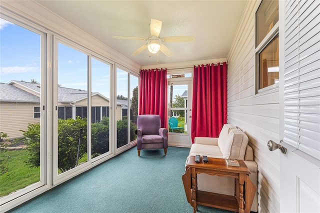 8076 SE 174th Belhaven Loop, The Villages, FL 32162 - sunroom / solarium with carpet floors, wooden walls, and ornamental molding