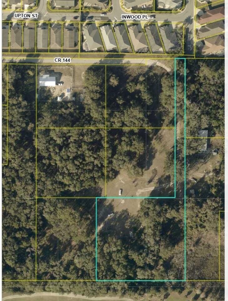 5447 County Road 144, Wildwood, FL 34785 - aerial map of property and surrounding area featuring property parcel outlined