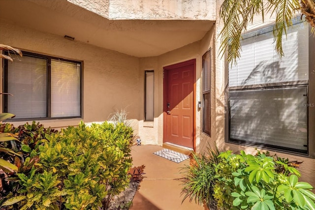 7421 Sugar Bend Dr Unit 7421, Orlando, FL 32819 - view of exterior entry featuring stucco siding