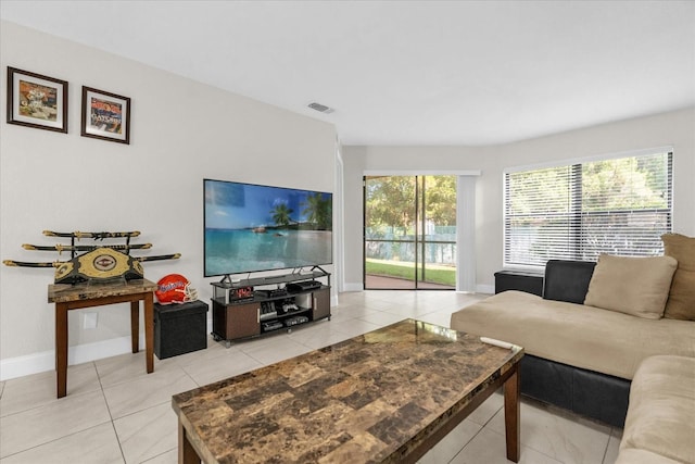 7421 Sugar Bend Dr Unit 7421, Orlando, FL 32819 - living room featuring light tile patterned floors