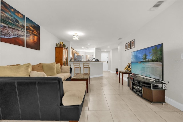 7421 Sugar Bend Dr Unit 7421, Orlando, FL 32819 - living room with light tile patterned flooring and recessed lighting