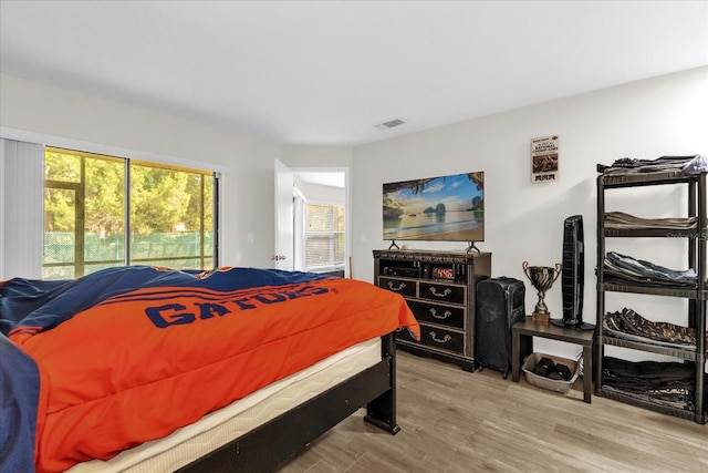 7421 Sugar Bend Dr Unit 7421, Orlando, FL 32819 - bedroom featuring wood finished floors