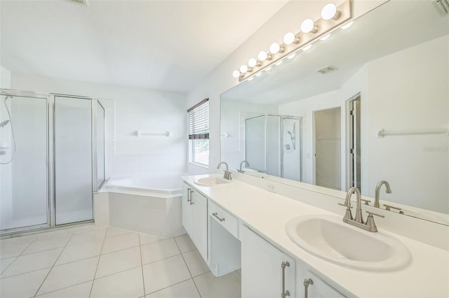 7716 Nottinghill Sky Dr, Apollo Beach, FL 33572 - bathroom with a stall shower, double vanity, a garden tub, tile patterned flooring, and a closet
