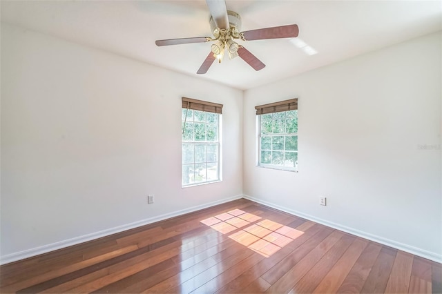 7716 Nottinghill Sky Dr, Apollo Beach, FL 33572 - spare room featuring wood-type flooring and ceiling fan