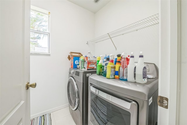 7716 Nottinghill Sky Dr, Apollo Beach, FL 33572 - washroom featuring washer and dryer and light tile patterned floors