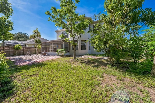 7716 Nottinghill Sky Dr, Apollo Beach, FL 33572 - view of yard with a sunroom and a patio