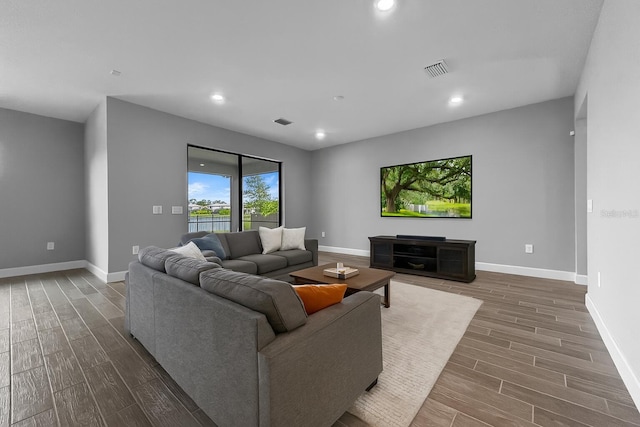 6256 Baywood Ct, Bradenton, FL 34211 - living room with dark wood-type flooring and recessed lighting