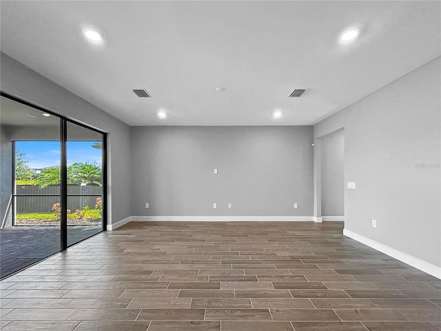 6256 Baywood Ct, Bradenton, FL 34211 - unfurnished room featuring wood finished floors and recessed lighting