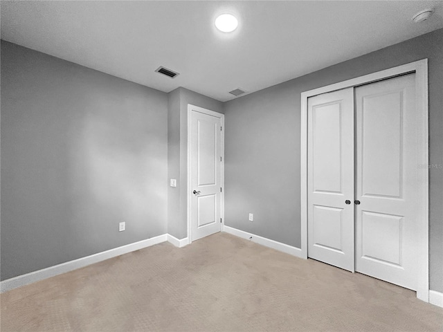 6256 Baywood Ct, Bradenton, FL 34211 - unfurnished bedroom featuring light carpet and a closet
