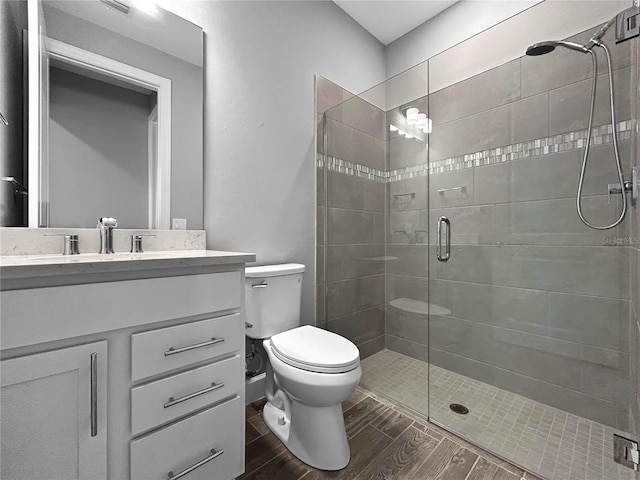 6256 Baywood Ct, Bradenton, FL 34211 - bathroom featuring vanity, a shower stall, and wood finished floors