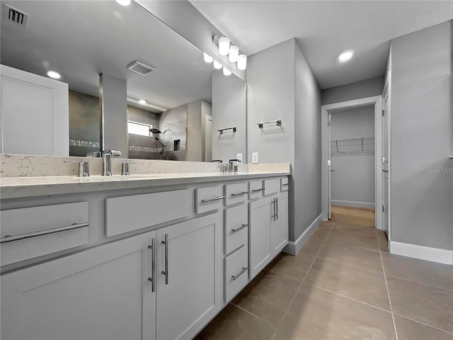 6256 Baywood Ct, Bradenton, FL 34211 - bathroom featuring double vanity, a stall shower, tile patterned floors, a spacious closet, and recessed lighting