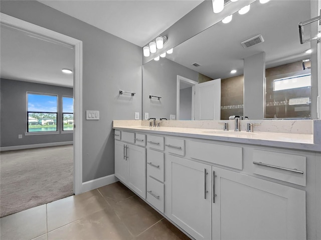 6256 Baywood Ct, Bradenton, FL 34211 - bathroom featuring double vanity, tile patterned floors, tiled shower, and recessed lighting