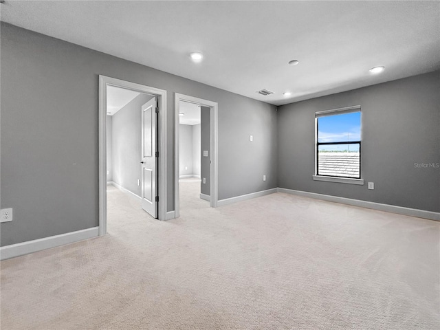 6256 Baywood Ct, Bradenton, FL 34211 - empty room featuring light carpet and recessed lighting