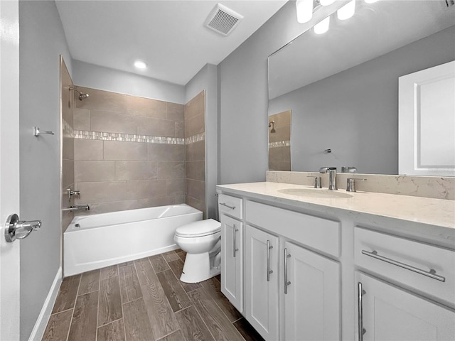 6256 Baywood Ct, Bradenton, FL 34211 - bathroom featuring vanity, wood tiled floors, shower / washtub combination, and recessed lighting