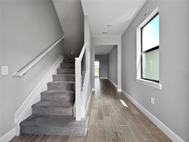 6256 Baywood Ct, Bradenton, FL 34211 - stairs with wood finished floors and baseboards