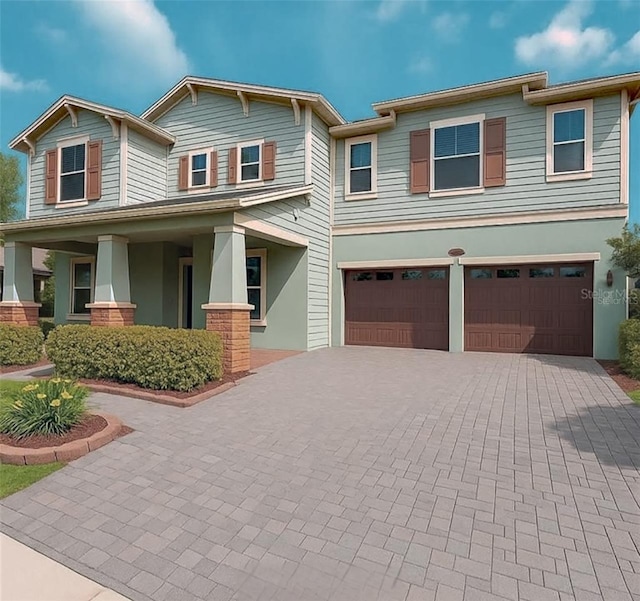 13525 Gorgona Isle Dr, Windermere, FL 34786 - view of front of home with an attached garage, decorative driveway, and stucco siding