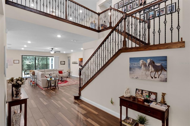13525 Gorgona Isle Dr, Windermere, FL 34786 - stairway with ceiling fan, wood finished floors, recessed lighting, and a high ceiling