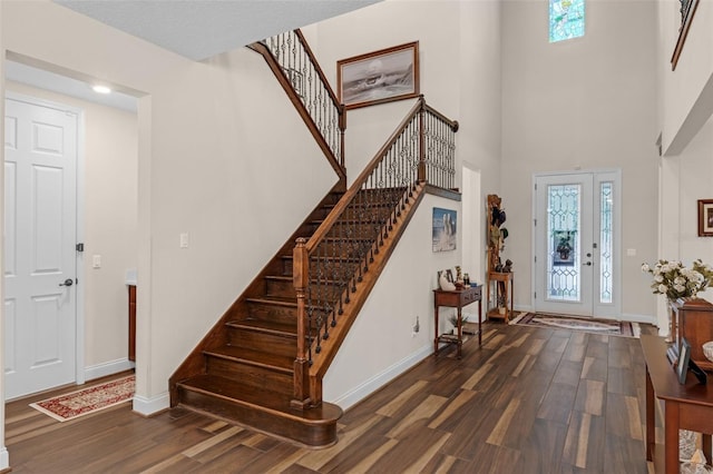 13525 Gorgona Isle Dr, Windermere, FL 34786 - foyer entrance with wood finished floors, stairway, plenty of natural light, and a towering ceiling