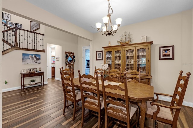 13525 Gorgona Isle Dr, Windermere, FL 34786 - dining area with a chandelier and dark wood-style flooring