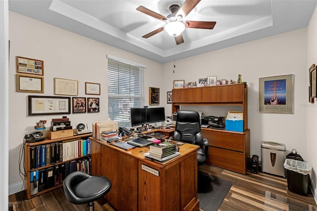 13525 Gorgona Isle Dr, Windermere, FL 34786 - office featuring a tray ceiling, ceiling fan, and dark wood-style floors