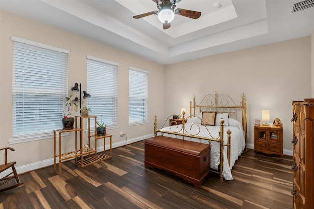 13525 Gorgona Isle Dr, Windermere, FL 34786 - bedroom featuring a tray ceiling and wood finished floors