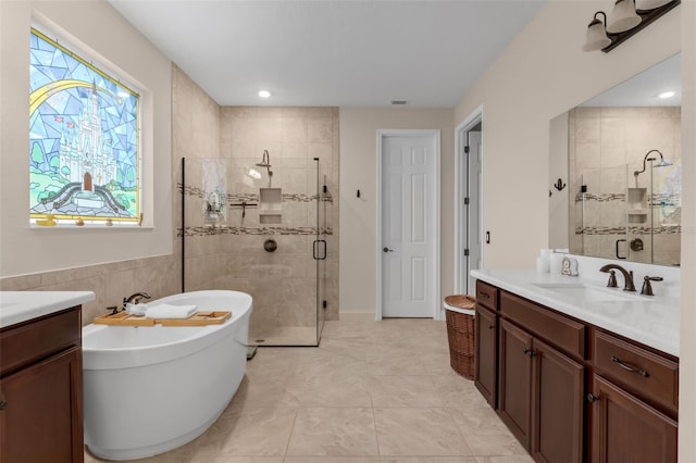 13525 Gorgona Isle Dr, Windermere, FL 34786 - full bath featuring two vanities, a shower stall, and a freestanding bath