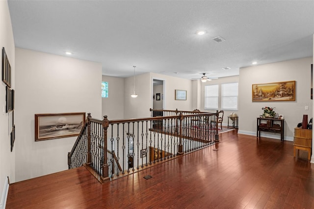 13525 Gorgona Isle Dr, Windermere, FL 34786 - hallway with an upstairs landing, healthy amount of natural light, wood-type flooring, and recessed lighting