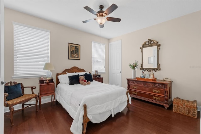 13525 Gorgona Isle Dr, Windermere, FL 34786 - bedroom with dark wood finished floors, multiple windows, and ceiling fan