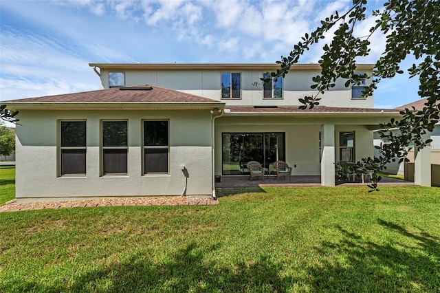 13525 Gorgona Isle Dr, Windermere, FL 34786 - back of property featuring a patio area, stucco siding, and a lawn