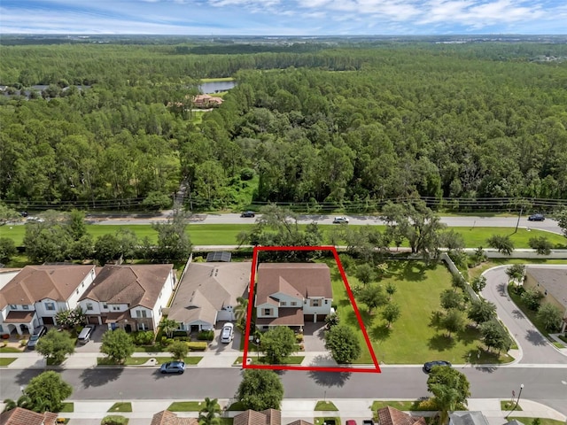 13525 Gorgona Isle Dr, Windermere, FL 34786 - aerial perspective of suburban area with a heavily wooded area and property parcel outlined