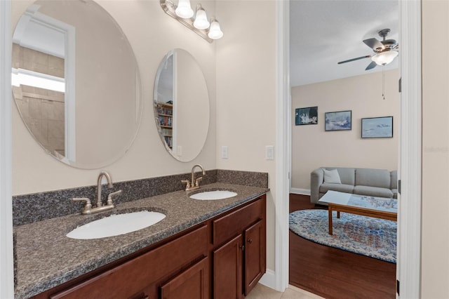 13525 Gorgona Isle Dr, Windermere, FL 34786 - full bathroom with ceiling fan, double vanity, wood finished floors, and connected bathroom