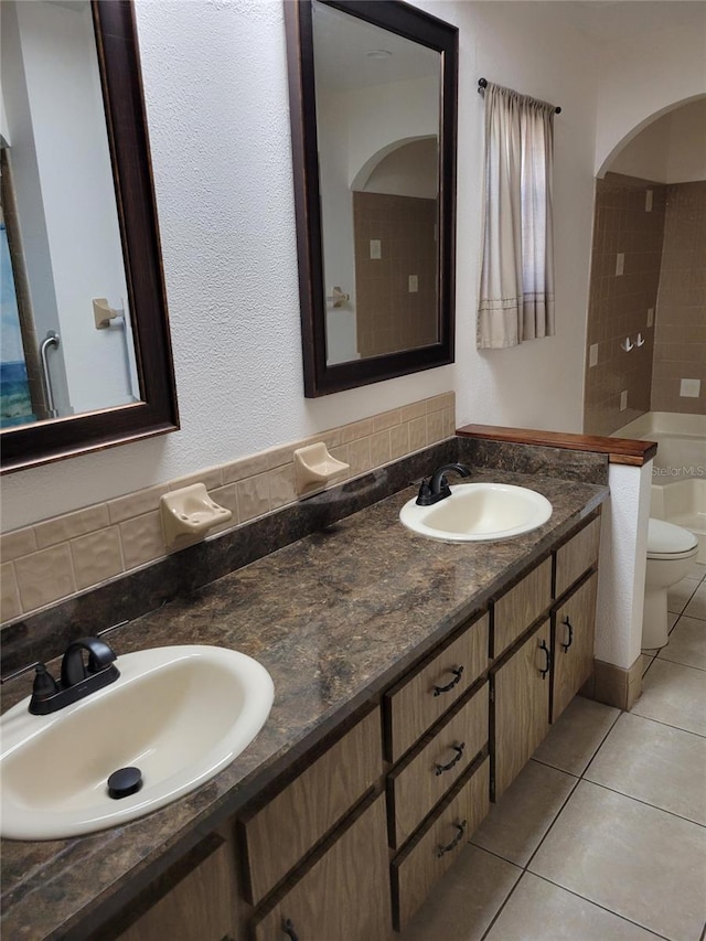 2320 NE 43rd St, Ocala, FL 34479 - full bath with tile patterned floors, double vanity, and backsplash