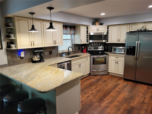 2320 NE 43rd St, Ocala, FL 34479 - kitchen featuring appliances with stainless steel finishes, open shelves, a peninsula, a breakfast bar, and recessed lighting