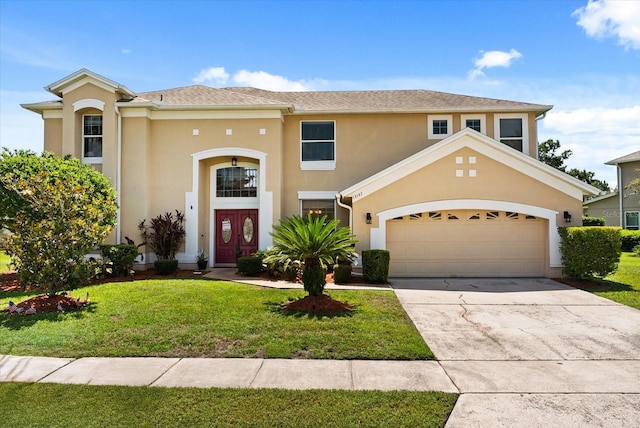 13147 Meergate Cir, Orlando, FL 32837 - view of front of home featuring a front yard, stucco siding, and concrete driveway