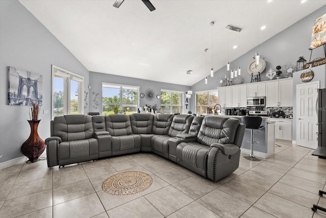 13147 Meergate Cir, Orlando, FL 32837 - living room featuring light tile patterned flooring, high vaulted ceiling, a ceiling fan, and recessed lighting