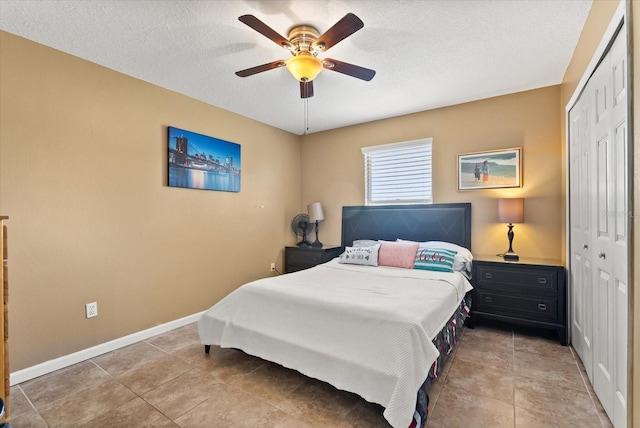 13147 Meergate Cir, Orlando, FL 32837 - bedroom featuring a closet, a textured ceiling, and a ceiling fan