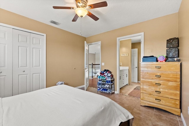 13147 Meergate Cir, Orlando, FL 32837 - bedroom with light tile patterned floors, a closet, and ceiling fan