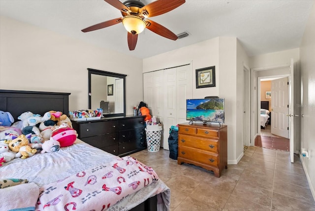 13147 Meergate Cir, Orlando, FL 32837 - bedroom with a closet, light tile patterned flooring, and ceiling fan