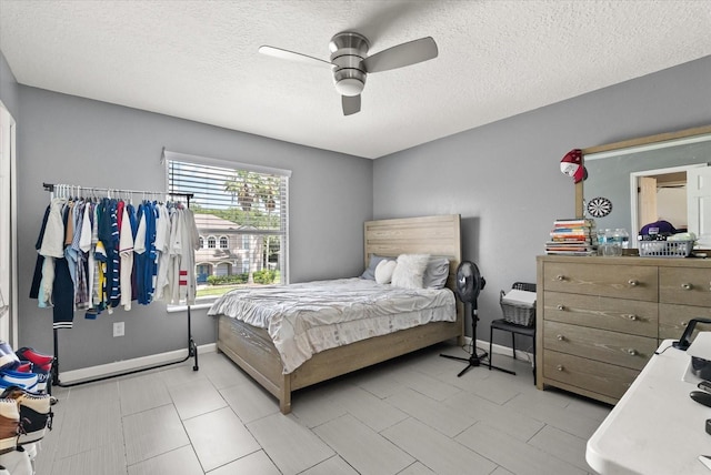 13147 Meergate Cir, Orlando, FL 32837 - bedroom with a textured ceiling and a ceiling fan