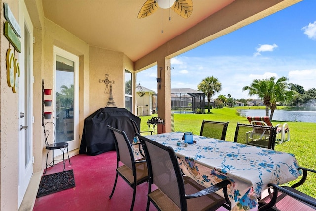 13147 Meergate Cir, Orlando, FL 32837 - view of patio with area for grilling, a water view, a ceiling fan, and outdoor dining space