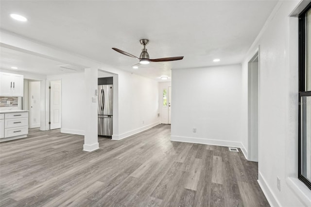 18015 Beach St, Umatilla, FL 32784 - unfurnished living room with ceiling fan, wood finished floors, and recessed lighting