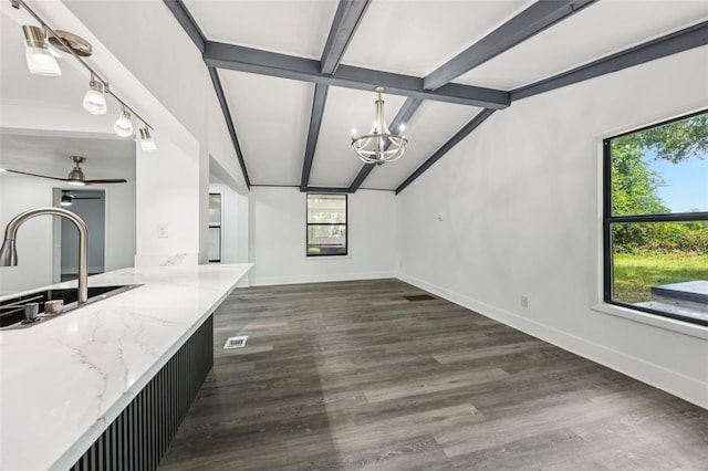 18015 Beach St, Umatilla, FL 32784 - unfurnished living room featuring a chandelier, dark wood finished floors, and a ceiling fan