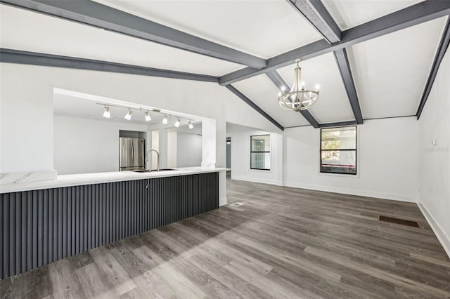 18015 Beach St, Umatilla, FL 32784 - unfurnished living room featuring a chandelier and wood finished floors